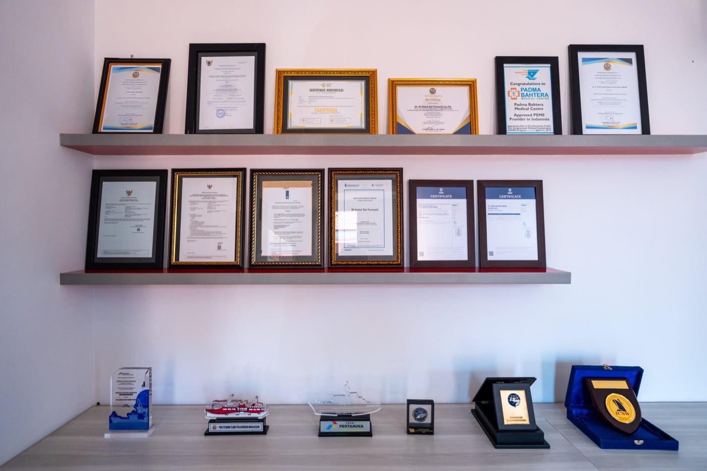 B2: certification wall, legible